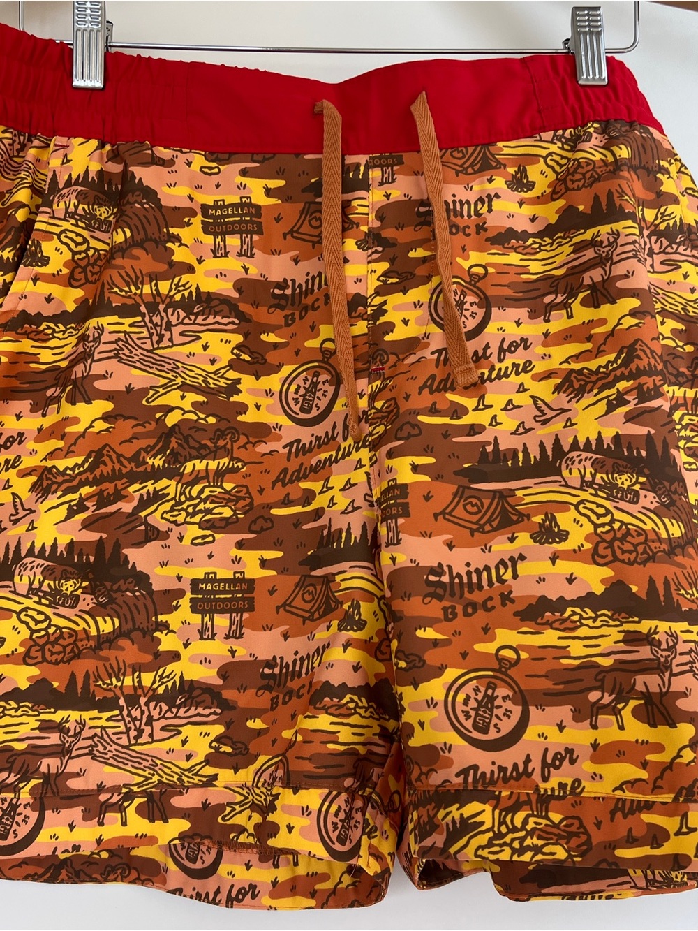 Magellan Outdoors Red Swim Trunks with Yellow and Brown Adventure Print